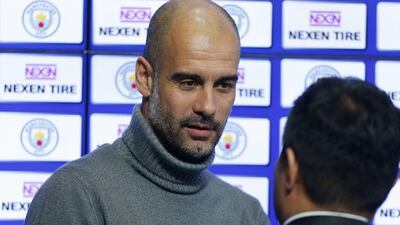 Manchester City manager Pep Guardiola and Nexen Tire chief executive Travis Kang during the announcement of a partnership with Nexen Tire Action. Ed Sykes / Reuters