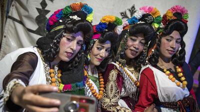 Berber women pose for a selfie during the Engagement Moussem. Photo: Fadel Senna / AFP