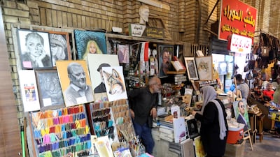 Ali Al Mandalawi speaks to a customer.