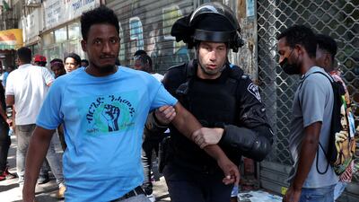 Israeli security forces detain an Eritrean protester in Tel Aviv. AFP