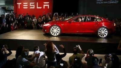 Elon Musk, the Tesla chief executive, drives a Model S, the company's first full-size electric car, in Fremont, California. Stephen Lam / Reuters