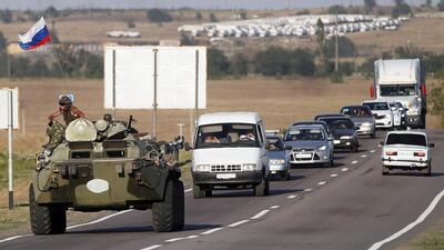 A Russian armoured vehicle outside the town of Kamensk-Shakhtinsky, about 30 km from the border with Ukraine, where a Russian aid convoy is waiting to cross over. Yuri Kochetkov / EPA / August 15, 2014