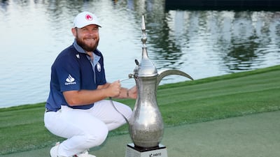 Tyrrell Hatton of England poses with the Dallah Trophy after winning the Hero Dubai Desert Classic at Emirates Golf Club on Sunday, January 19, 2025. Getty Images