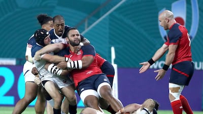 Billy Vunipola, third from left, of England in action during the Rugby World Cup clash against USA at Kobe Misaki Stadium. EPA