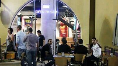 People having food at around 3am at the Burger Fuel restaurant in Jumeirah Beach Residence in Dubai.