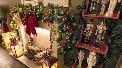 A faux fireplace and shelf for the family's Nutcracker collection in the living room