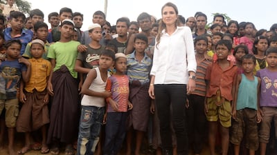 Jordan's Queen Rania poses with Rohingya refugee children and youths during her visit to the Kutupalong refugee camp in Ukhia. Tauseef Mustafa / AFP