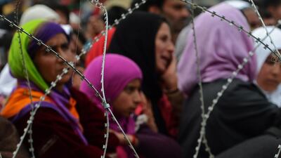 Supporters listen as unseen union minister, patron for the National Conference and candidate for Srinagar’s seat for the lower house of parliament in India’s general election Farooq Abdullah speaks during an election rally in Chadoora. Tauseef Mustafa / AFP Photo