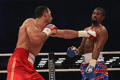 David Haye, right, takes a jab from Wladimir Klitschko during their heavyweight fight in Hamburg, Germany, in July 2011. Getty Images