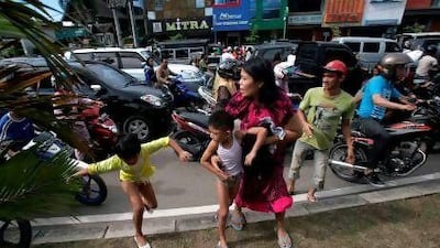 Residents of Banda Aceh run shortly after a powerful earthquake hit western coast of Sumatera. A massive earthquake struck off Indonesia's Sumatra island, US and Indonesian monitors reported, prompting an Indian Ocean-wide tsunami alert.