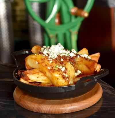 Black truffle poutine. Courtesy Butcher & Still