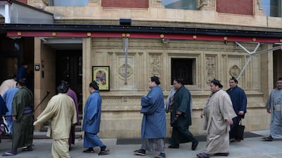 Rikishi sumo wrestlers arrive at the Royal Albert Hall in central London, ahead of the Grand Sumo Tournament. AFP