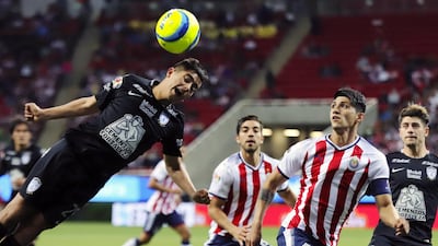 Alan Pulido (2-R) of Chivas vies for a ball against Erick Sanchez (L) of Pachuca during the Clausura Tournament football match between Chivas of Guadalajara and Pachuca at the Arkon Stadium in Guadalajara, Mexico. Carlos Zepeda / EPA
