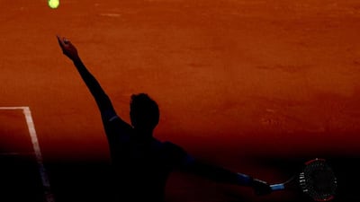 Argentina’s Renzo Olivo serves to homecrowd favourite Jo-Wilfried Tsonga at the French Open in Paris. Tatyana Zenkovich / EPA