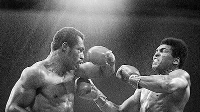 Muhammad Ali, right, winces as Ken Norton hits him with a left to the head during their re-match at the Forum in Inglewood, California. AP Photo