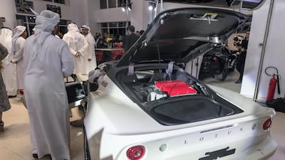 Visitors get a closer look at the cars.