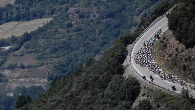 The peloton ride during the 184.5km ninth stage of the 103rd Tour de France cycling race on July 10, 2016 between Vielha Val d’Aran and Andorre Arcalis. Jeff Pachoud / AFP