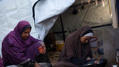 Palestinian women prepare the Iftar meal on the first day of Ramadan. AP