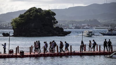 Tourists arrive. AFP