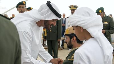 Sheikh Mohammed bin Zayed awards Sheikh Zayed bin Hamdan bin Zayed (2nd R), with a Medal of Bravery for his service in Yemen, during a Sea Palace barza. Seen with Sheikh Rashid bin Hamdan bin Zayed (R). Rashed Al Mansoori / Crown Prince Court - Abu Dhabi.