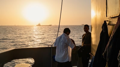 MUSCAT, OMAN - JUNE 23: Indian sailors go about their work after being stranded aboard their cargo vessel for days as congestion at Port Sultan Qaboos has prevented them from docking, leaving the ship anchored off the coast of Oman around Qaboos Port on June 23, 2026 in Muscat, Oman. The cargo vessel carries sugar and wheat. The Strait of Hormuz, a vital shipping route for the region's oil and gas, was effectively blockaded since the outbreak of war between the United States and Iran in late February. This week's provisional peace deal between the countries was meant to reopen the waterway to shipping traffic, but the pace of that reopening is unclear amid continued fighting in Lebanon and the need to clear the Strait of sea mines. On Sunday, U.S. Vice President JD Vance arrived in Switzerland for high-level talks with the Iranian delegation, as the two sides seek to clarify the terms of ending the war. (Photo by Elke Scholiers/Getty Images)