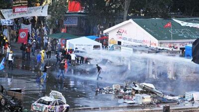 Police use a water cannon and tear gas to disperse protesters at Gezi Park near Taksim Square in Istanbul on Saturday. AFP