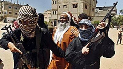 Members of a group called Jund Ansar Allah surround their leader Abdel-Latif Moussa, centre, after Friday prayers. Moussa was killed in the fighting with Hamas police.
