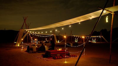 Enjoy an Arabic feast under the stars at Mleiha National Park. Photo: Zerzura