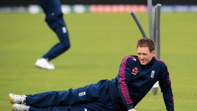 England's Eoin Morgan stretches during Tuesday's training session in Durham. PA Photo