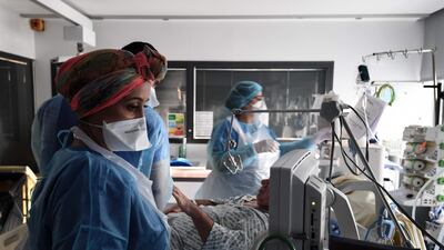 Medical staff tend to a patient at the intensive care unit for patients infected with Covid-19 at the AP-HP Tenon hospital in Paris. AFP