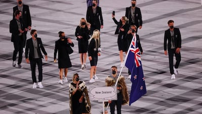 Flag bearers Hamish Bond of New Zealand and Sarah Hirini of New Zealand lead their contingent.