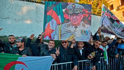 People gather outside the "Palais du Peuple". AFP