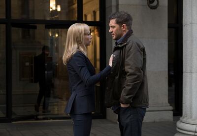 Michelle Williams, left, and Tom Hardy in a scene from Venom
