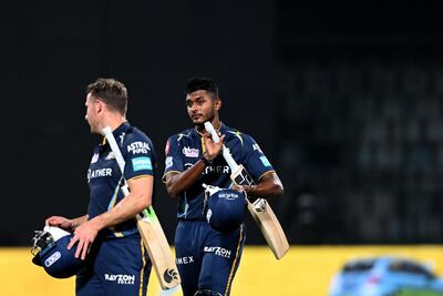 David Miller (L) and Sai Sudharsan walk off after their win in New Delhi. AFP