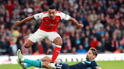 Arsenal's Theo Walcott, left, and Middlesbrough's Gaston Ramirez in action during the English Premier League match at the Emirates stadium in London, Britain, 22 October 2016. Sean Dempsey / EPA