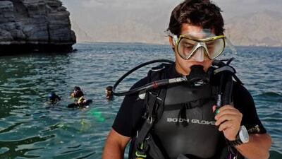 Divers escape the heat while indulging their passion on the west coast, north of Dibba.