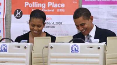 Barack Obama and his wife Michelle vote in the election at the Beulah Shoesmith Elementary School in Chicago.