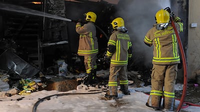 A fire that broke out at the stores of a supermarket in Mussaffah left six people injured. Courtesy Security Media
