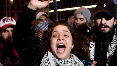 An anti-government protester shouts slogans, during ongoing protests against the ruling elite of corruption and financial crisis, in Beirut, Lebanon. AP