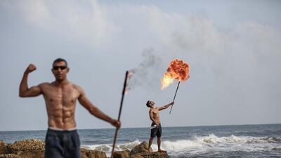 A fire-breathing performance in Gaza. Photo by Majd Mahmoud