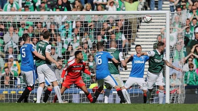 Anthony Stokes (R) scores the second goal for Hibernian. Reuters / Russell Cheyne
