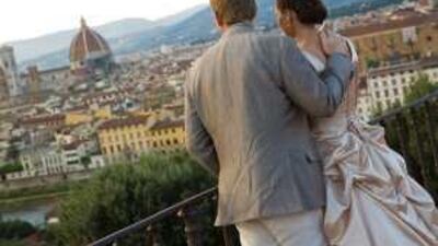 Anna and Tim Miles look out onto the town of Bagno a Ripoli, Italy, on their wedding day.