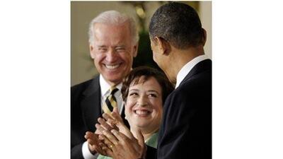 Elena Kagan is applauded by the US president, Barack Obama, foreground, and the vice-president Joe Biden as she is introduced as a nominee for the Supreme Court at the White House in Washington yesterday. Susan Walsh / AP Photo