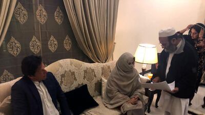 Imran Khan sitting with his bride Bushra Bibi during his marriage ceremony in Lahore. EPA