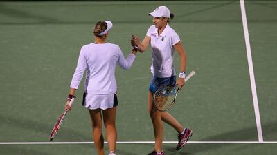 Nuria Llagostera Vives of Spain and Jie Zheng of China lose to Nadia Petrova of Russia (l) and Katerina Srebotnik of Slovenia Julian Finney/Getty Images