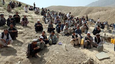 Afghans pray during the funeral of a victim who died in Wednesday's deadly suicide bombing. AP