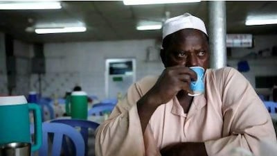 January 30, 2012 (Abu Dhabi) Abdul Al Baqi, 50, a truck driver from the Sudan stops for a short break before hitting the road on his way toward Yeman. The UAE government recently announced plans to build a new highway to replace the 2 lane highway. (Sammy Dallal / The National)