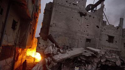 The rubble of homes that were destroyed by the Israeli military during an offensive that killed over 2,100 Palestinians and displaced hundreds of thousands. (AFP/Roberto Schmidt)