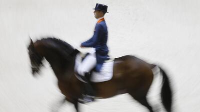 Dutch rider Hans Peter Minderhoud on horse Glock’s Johnson TN competes in the Reem Acra FEI World Cup Dressage Final, held at the Eurexpo centre near Lyon, France. Ian Langsdon / EPA / April 20, 2014