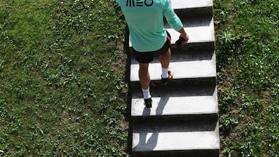 Portugal’s forward Cristiano Ronaldo climbs a stairway as he arrives for a training session at the team’s training ground in Marcoussis, south of Paris, on July 8, 2016, ahead of their Euro 2016 final football match against France. / AFP / FRANCISCO LEONG